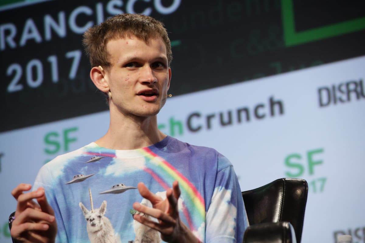 Photo of Vitalik Buterin (wearing a tshirt with unicorn llamas, spaceships and a rainbow).